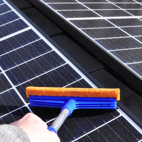 cleaning-solar-panels-with-a-wiper-2022-03-24-23-21-27-utc